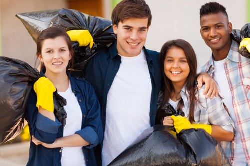 Workers sorting recyclable materials at a commercial site
